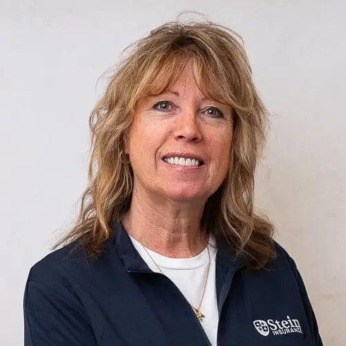 a woman with blonde hair smiling